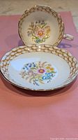 Royal Albert saucer front and cup interior showing basket-weave border and floral spray