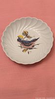 Front of Haviland Limoges bird plate showing design and fluted rim