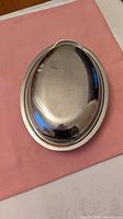 Closed oval stainless dish with lid