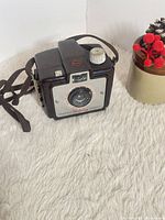 Front and side view of Kodak Brownie Holiday Camera showing strap