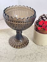 Front view of olive Mariskooli candy dish