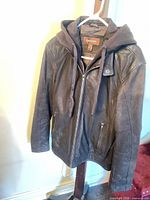 Full front view of jacket on hanger showing overall design and color