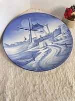 Full view of blue ceramic plate with windmill scene
