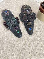 Both wooden tribal masks front view