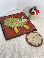 Rectangular sheep coaster and round floral coaster full view