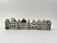 Front lineup of all nine Delft Blue houses in a row