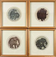 All four framed round etchings front view