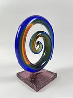 Front view showing full spiral form and rose base