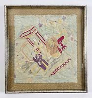 Full view of framed embroidered panel