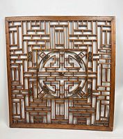 Full view of wooden fretwork screen showing overall lattice design