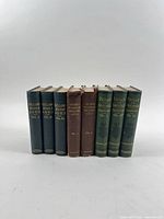 Group shot of all eight volumes showing spines