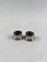 Pair of sterling holders side by side