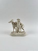 Front view of Parian figurine showing boy and greyhound on oval base