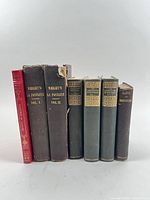 Front view of all seven book spines