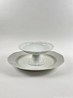 Footed fruit bowl on platter frontal view