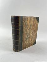 Spine view showing half leather binding and gilt title