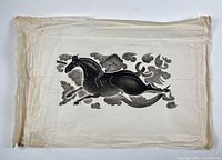 Full view of folded rice paper with horse rubbing