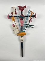 Full view of painted cut-tin assemblage