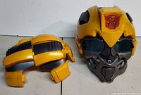 Front and rear pieces of yellow Bumblebee helmet