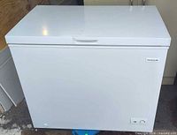 Front view of white Frigidaire chest freezer closed