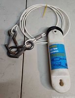 Full view of Berkley ski tow harness with float, cable and hooks