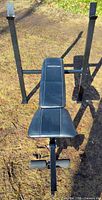 Top view of Competitor weight bench showing padded backrest, seat, barbell uprights and leg developer