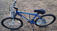 Left side view of entire blue Roadmaster mountain bike
