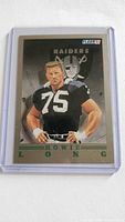 Front view of 1991 Fleer Howie Long Raiders football card in plastic holder