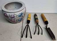 Planter and three garden tools overview