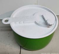 Green salad spinner with lid assembled