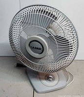 Full view of the Lasko tabletop fan showing grille and base