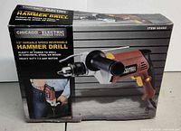 Retail box showing Chicago Electric 1/2" variable speed reversible hammer drill details