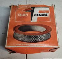 Front of FRAM box showing model CA148PL and branding