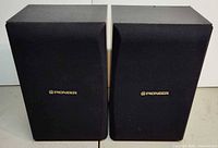 Front view of both Pioneer speakers with grills on