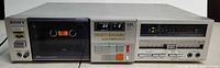 Front view of Sony TC-FX6 cassette deck showing tape door, controls and meters