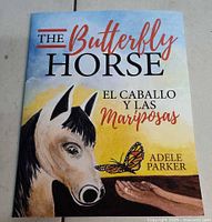 Front cover showing title, artwork of horse and butterfly