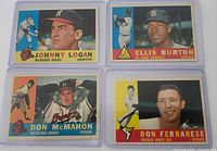 fronts of four vintage Topps baseball cards in sleeves