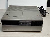 Front and top of JVC TU-26U showing controls and surface condition