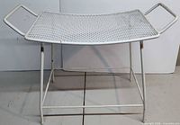 Full view of white metal mesh garden stool