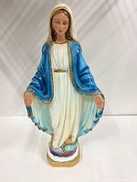 Front view of painted Virgin Mary statue on cloud base