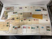 Overview of spread-out vintage US postal cards and envelopes