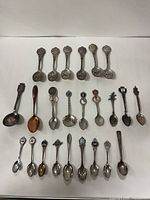 overview of 24 spoons laid out