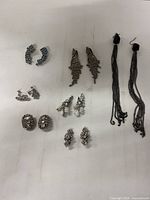 All seven pairs of earrings laid out for overview