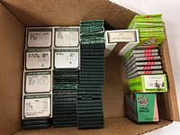 Full lot inside carton showing Groz-Beckert plastic cases and Organ paper packs