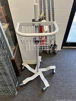 Full view of cart showing basket, pole, five-leg base, casters