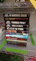 Spine view showing stack of Jack Higgins hardcover novels