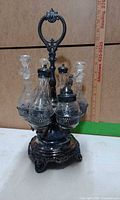 full view of assembled cruet set with bottles in stand