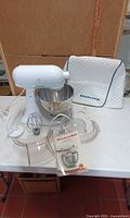 Mixer with bowl, attachments, manual, shield pieces, cover