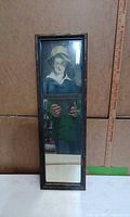 full view of tall narrow trumeau mirror showing portrait and mirror sections