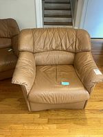 front view of armchair showing overall style and wear